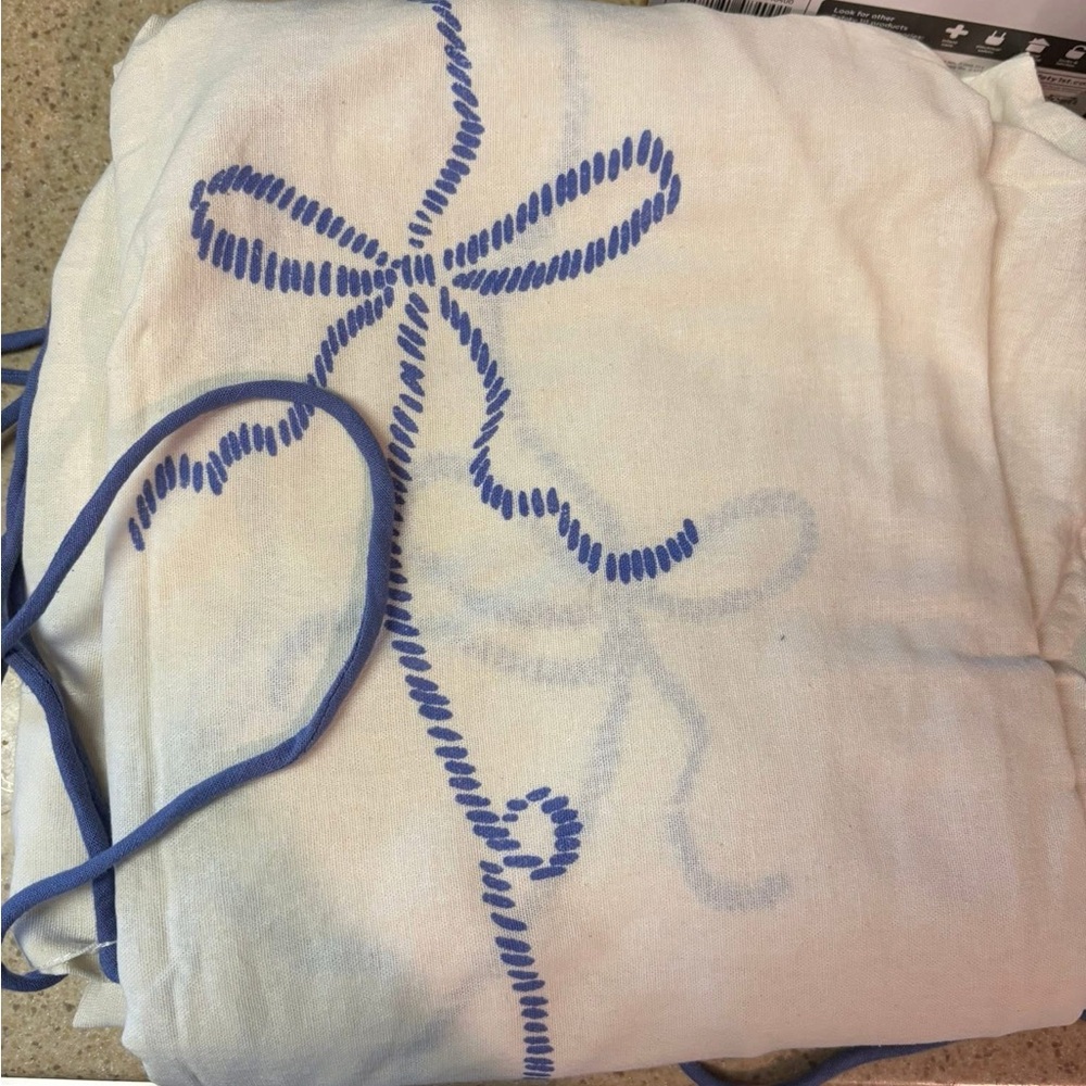 White Fabric with Blue Embroidery
